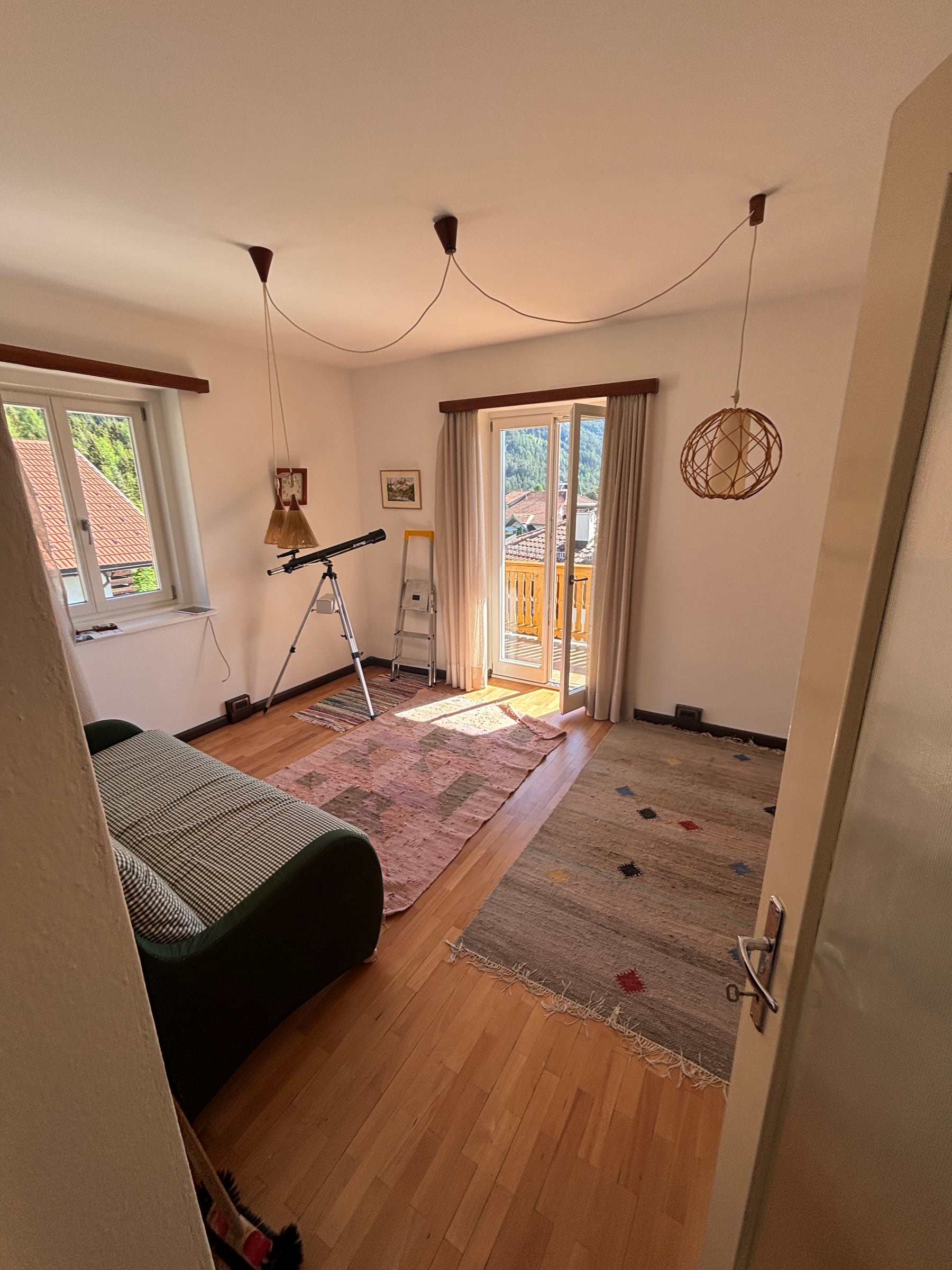 Bright living room with balcony access